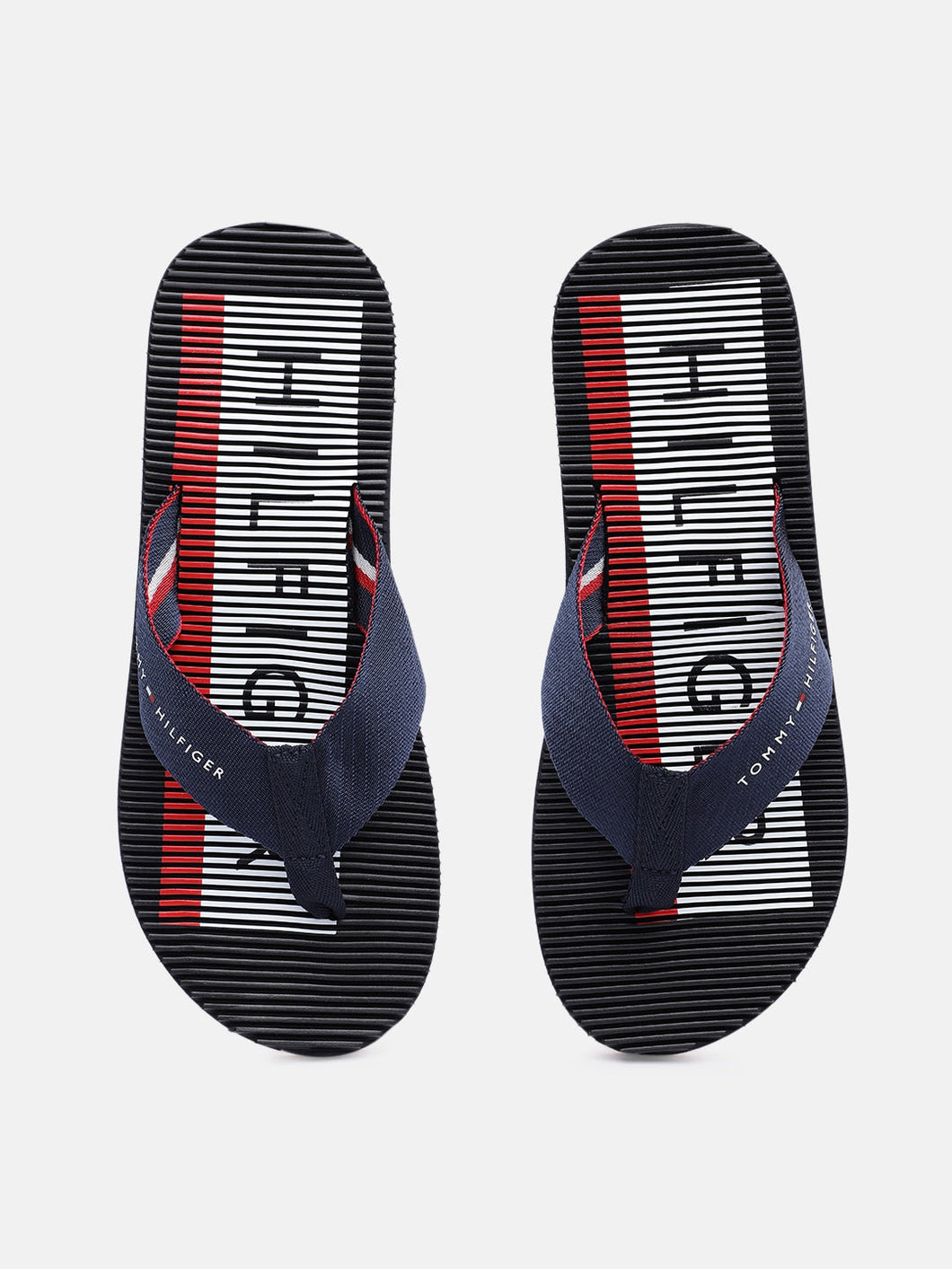 05cc2489-8fb2-41c7-aa7a-961e899a1aeb1628665656935-Tommy-Hilfiger-Men-Flip-Flops-1161628665656492-1.jpg