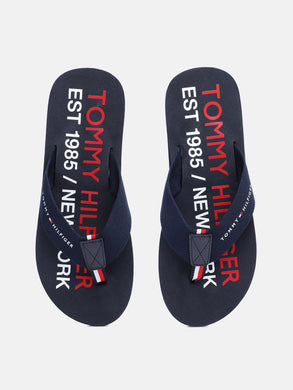 104d6d9c-a0e6-4583-9fbc-320c1ac625401628665584792-Tommy-Hilfiger-Men-Flip-Flops-5701628665584368-1.jpg