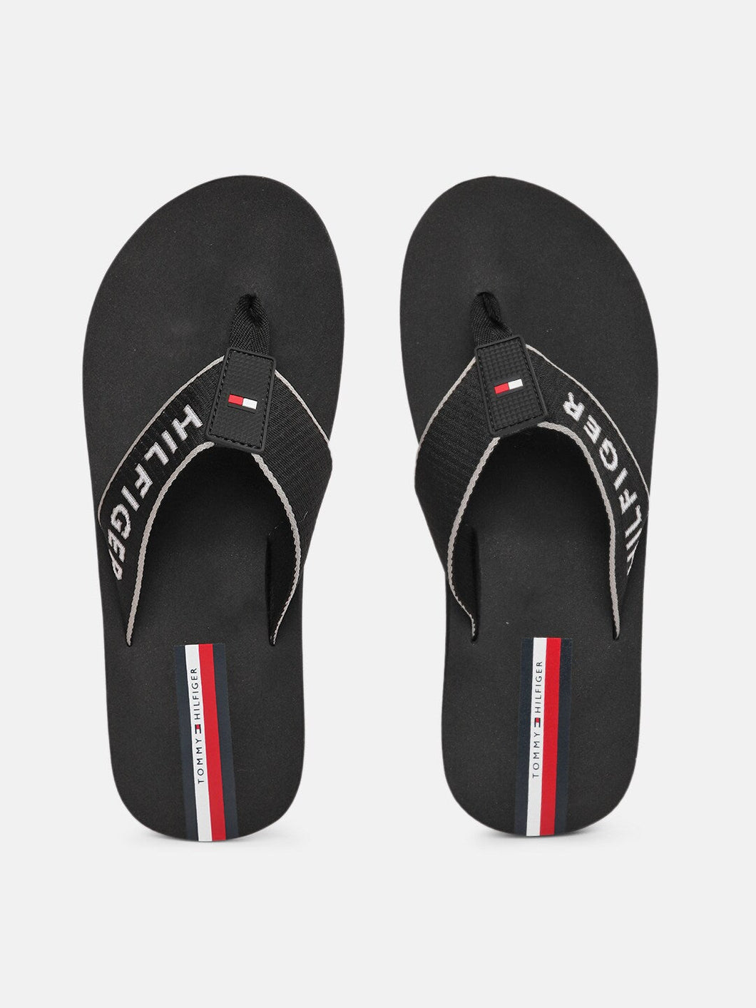 2809a6ca-ab35-492a-8918-b35d303eafae1628665362832-Tommy-Hilfiger-Men-Black-Printed-Thong-Flip-Flops-7321628665-1.jpg