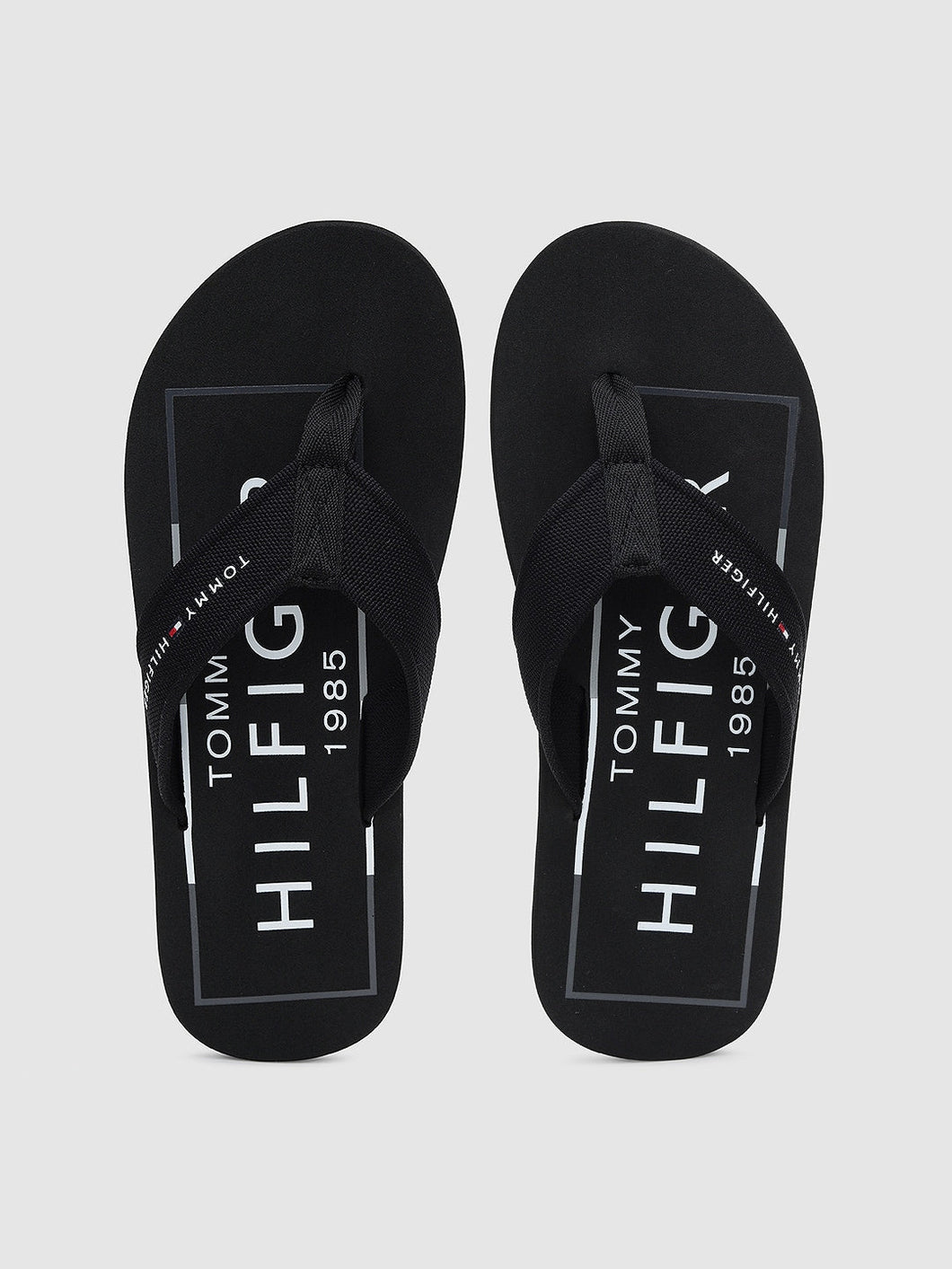 377d759d-573a-41f8-b9bc-4e07824509451592207342979-Tommy-Hilfiger-Men-Black-Printed-Thong-Flip-Flops-3941592207-1.jpg