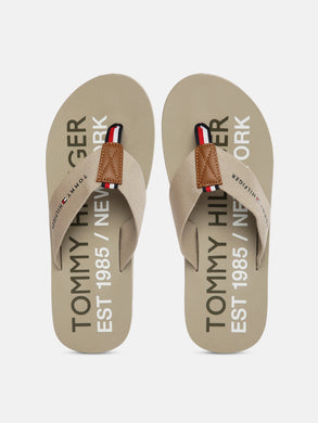 791b3080-57a5-4dbc-bab2-cec242a561d51628665346756-Tommy-Hilfiger-Men-Beige-Printed-Thong-Flip-Flops-9401628665-1.jpg