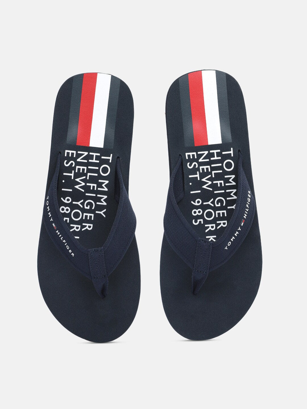 b7e9a1f8-efea-4c0f-bddf-ffe285b3743c1628665634764-Tommy-Hilfiger-Men-Flip-Flops-8561628665634358-1.jpg